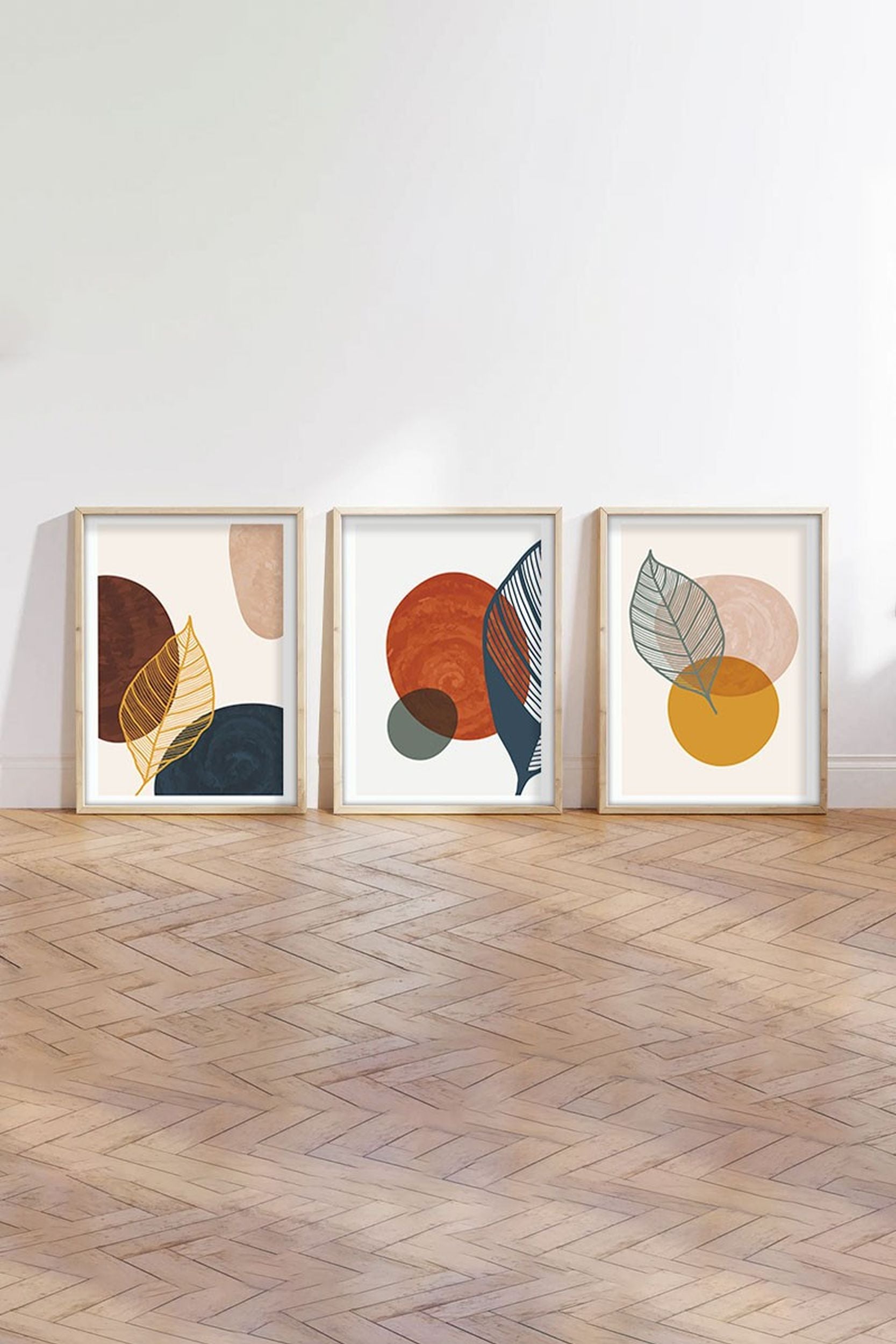Zestaw trzech obrazów Bodenass 50x70 cm liście i koła