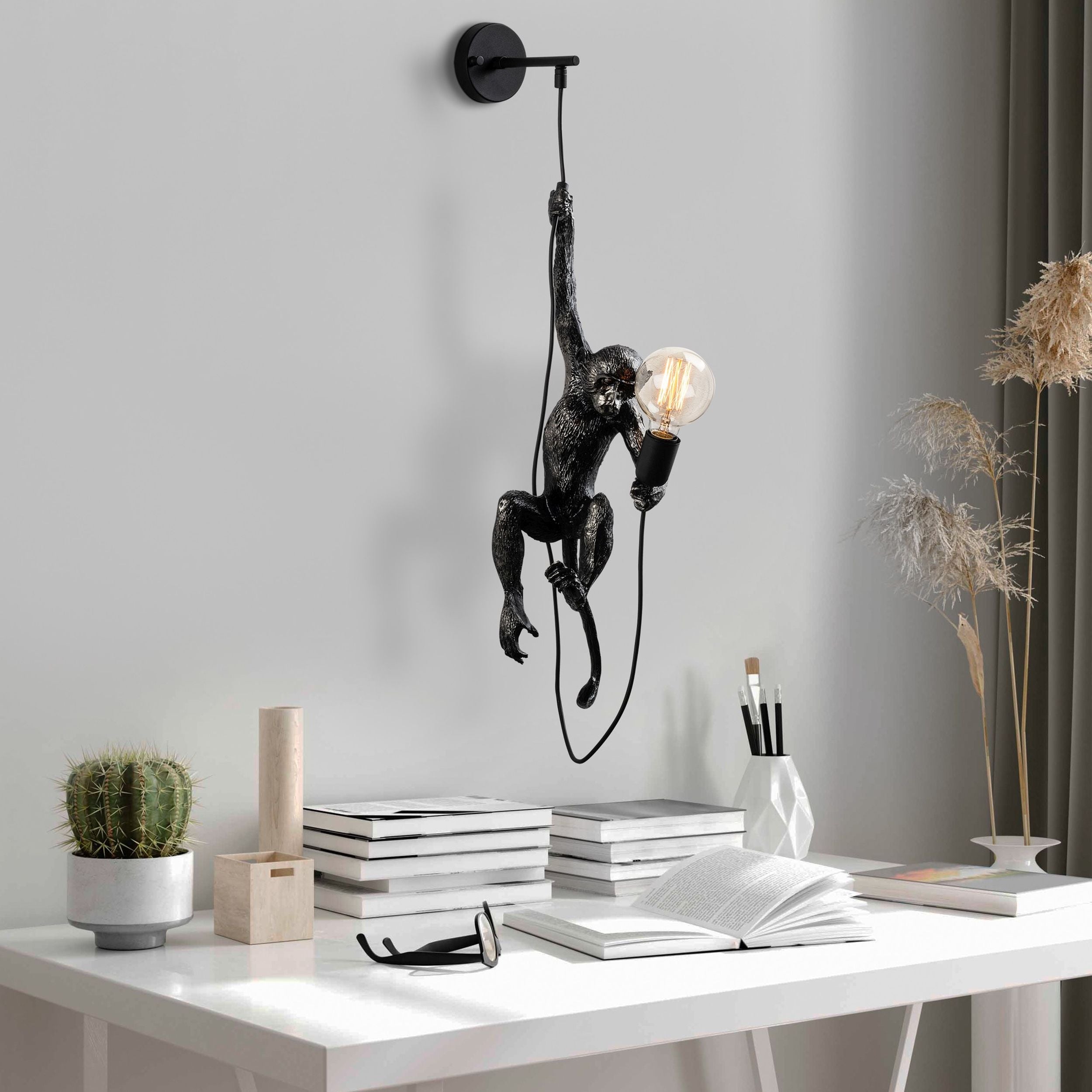 Lampa ścienna Proffitz z małpką czarna
