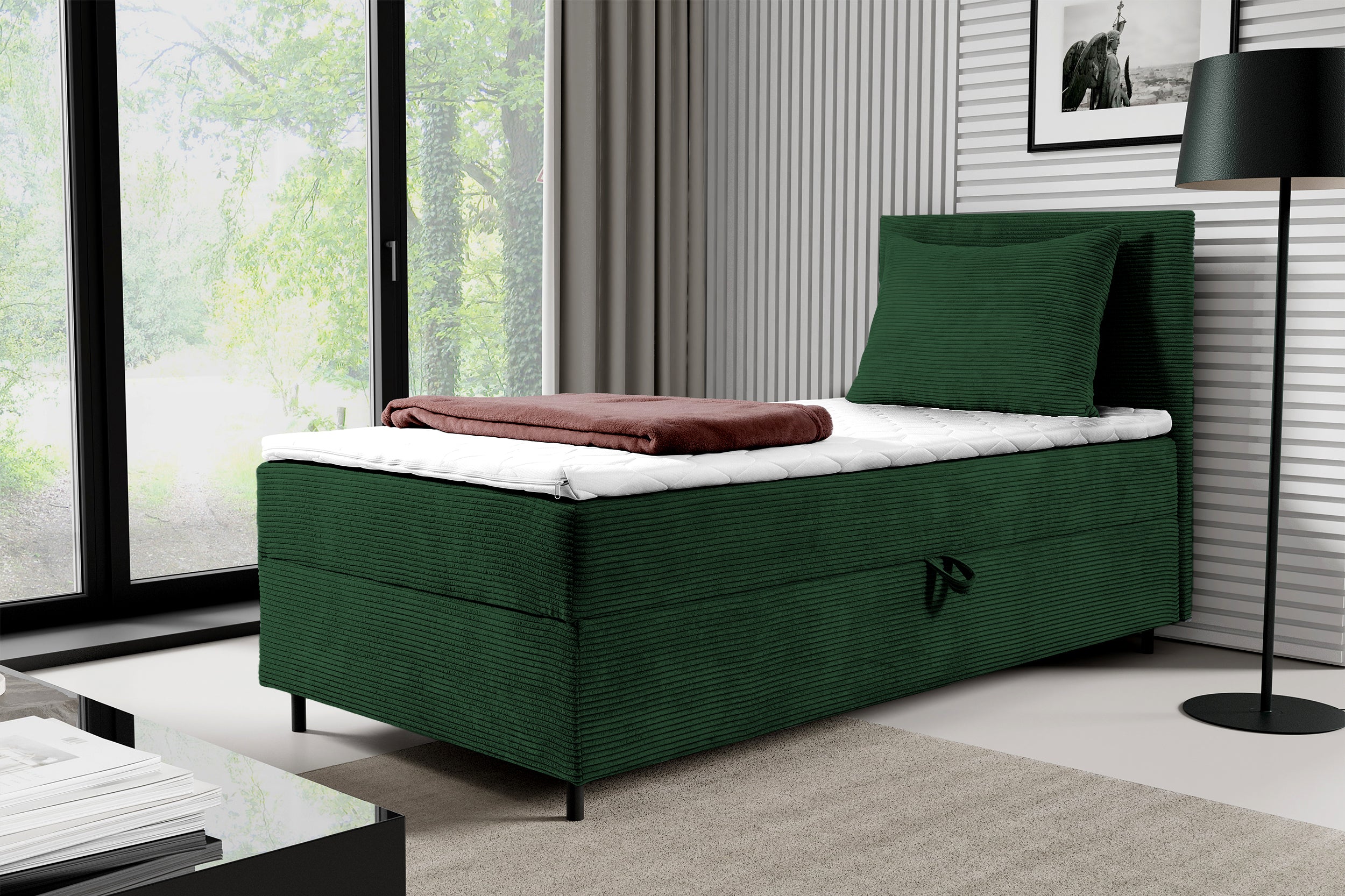 Łóżko kontynentalne jednosobowe Montigo Mini 100x200 cm z pojemnikiem, topperem i poduszką ciemnozielone sztruks nogi czarne prawostronne